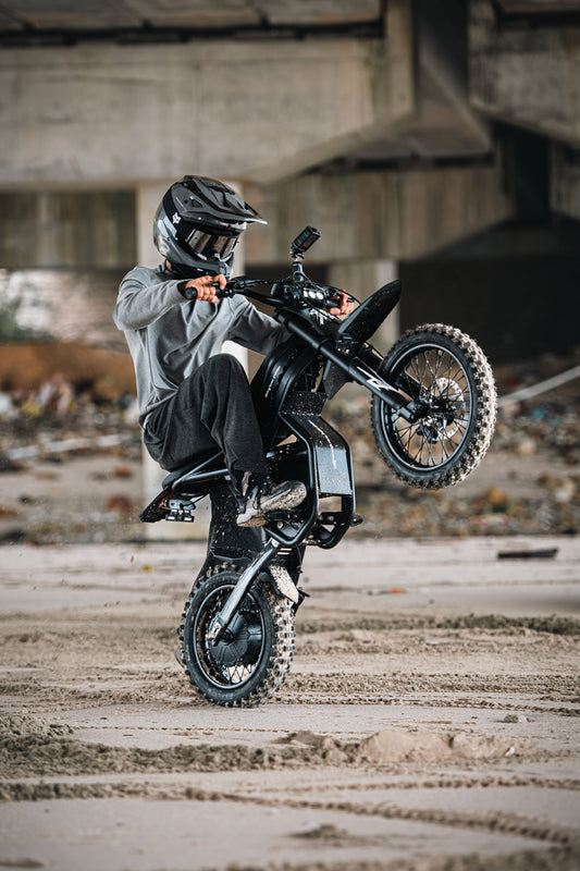 2025 Riding Times eBike Trends: Stunt rider performing wheelie on Riding Times GT54 eBike 2025