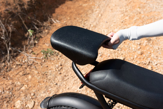 Removable seat extension for Z8 motorcycle in outdoor setting.